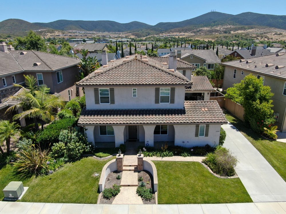 California-style home with clay tile roof