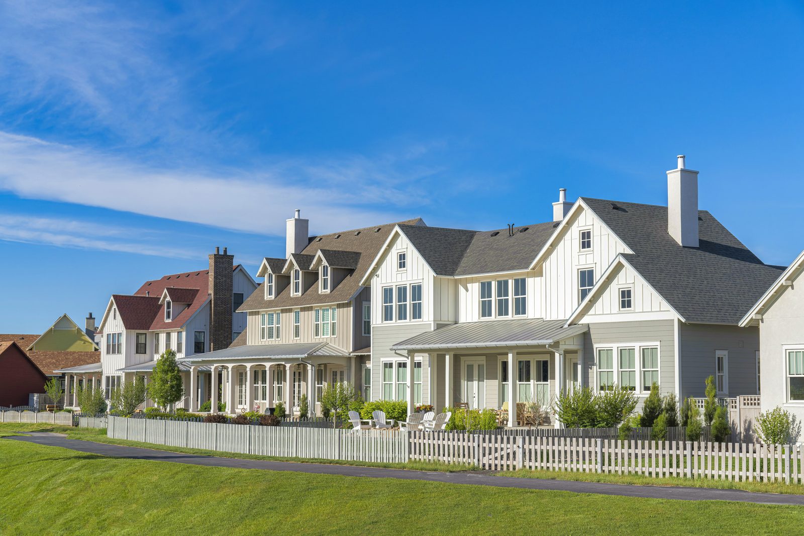Row of suburban homes with various roof styles